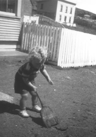 404: Jack Hennessey (visitor) sweeping the road in front of McCarthy's shop. (1950)  - son of John Hennessey &amp;amp; Anastasia McCarthy404: Jack Hennessey (c 1950)